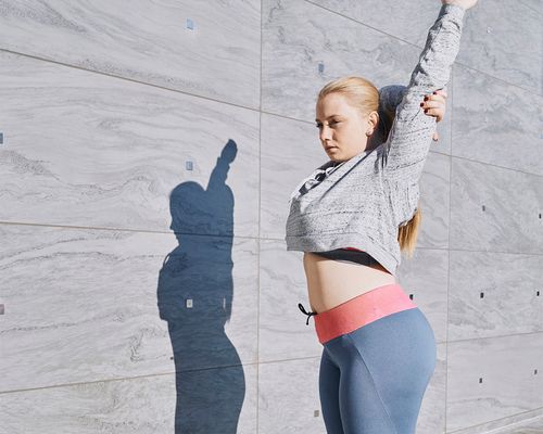 person stretching outside